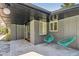 Charming covered porch area with stylish tile flooring and cozy seating at 8540 W 59Th Ave, Arvada, CO 80004