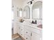 Bathroom with double vanity, quartz countertops and black accents at 10283 Spotted Owl Ave, Highlands Ranch, CO 80129