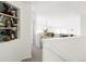 Upper hallway with built-in shelves and a view into an adjacent room at 10283 Spotted Owl Ave, Highlands Ranch, CO 80129