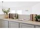 Built-in shelving with books and plants in an upper hallway at 10283 Spotted Owl Ave, Highlands Ranch, CO 80129