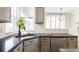 Kitchen features corner sink, gray cabinets, and dark countertops at 10283 Spotted Owl Ave, Highlands Ranch, CO 80129