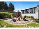 Landscaped backyard with patio seating, a fire pit, and privacy fencing perfect for relaxation at 3147 W 39Th Ave, Denver, CO 80211