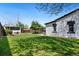 Spacious backyard with lush green grass and a tree at 3147 W 39Th Ave, Denver, CO 80211