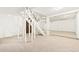 Unfinished basement with painted white wooden support beams, white walls, and neutral carpet at 3147 W 39Th Ave, Denver, CO 80211