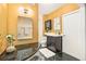 Well-lit bathroom featuring a vanity, medicine cabinet, white shag rug, and tiled floors at 3147 W 39Th Ave, Denver, CO 80211