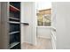 Spacious walk-in closet with custom white and black shelving and neutral carpeted flooring at 3147 W 39Th Ave, Denver, CO 80211