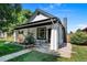 Charming home with landscaped front yard, stone accents, and inviting front porch at 3147 W 39Th Ave, Denver, CO 80211