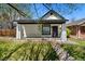 Charming single-story home with a quaint front porch, landscaped garden, and inviting curb appeal at 3147 W 39Th Ave, Denver, CO 80211