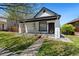 Charming single-story home with a quaint front porch, landscaped garden, and inviting curb appeal at 3147 W 39Th Ave, Denver, CO 80211
