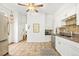 Open kitchen features stainless steel appliances, white cabinets and tile floors at 3147 W 39Th Ave, Denver, CO 80211