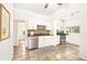 Cozy kitchen features stainless steel appliances, white cabinets and tile floors at 3147 W 39Th Ave, Denver, CO 80211