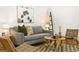 Bright living room features hardwood floors, decorative rug, modern furniture and a cozy seating area at 3147 W 39Th Ave, Denver, CO 80211