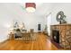 Inviting living room with hardwood floors, stone fireplace and an open layout at 3147 W 39Th Ave, Denver, CO 80211