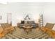 Bright living room features hardwood floors, decorative rug, modern furniture and a cozy seating area at 3147 W 39Th Ave, Denver, CO 80211