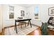 Bright home office with hardwood floors, modern black desk, and two large windows at 3147 W 39Th Ave, Denver, CO 80211