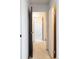 Hallway with neutral carpet, white walls, and doors leading to other rooms at 3470 S Poplar St # 401, Denver, CO 80224