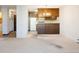 Open floorplan with view into the kitchen with bar seating at 3470 S Poplar St # 401, Denver, CO 80224