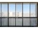 A window view of multiple story apartment buildings from a sunroom at 3470 S Poplar St # 401, Denver, CO 80224