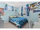 Vibrant bedroom with blue walls, playful decor, and comfortable bed at 11320 Irma Dr, Northglenn, CO 80233