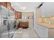 Modern kitchen featuring stainless steel appliances, granite countertops, and ample cabinet space at 11320 Irma Dr, Northglenn, CO 80233