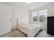 Bedroom with neutral carpeting, two windows, and a double bed at 4028 N Rome St, Aurora, CO 80019