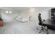 Bonus room with a sofa, desk, and chair set up on neutral carpeting at 4028 N Rome St, Aurora, CO 80019