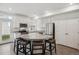 Well-lit kitchen with granite countertops, stainless steel appliances, and breakfast bar seating at 4028 N Rome St, Aurora, CO 80019