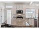 Clean kitchen with granite countertops, stainless appliances, and white cabinets at 4028 N Rome St, Aurora, CO 80019