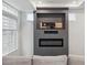 Cozy living room with built-in media center and fireplace, perfect for relaxation at 4028 N Rome St, Aurora, CO 80019