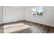Bright bedroom with large window, closet and modern flooring at 13095 W Cedar Dr # 302, Lakewood, CO 80228