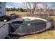 View of the seasonal community pool, currently covered, surrounded by a metal fence at 13095 W Cedar Dr # 302, Lakewood, CO 80228