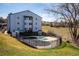 View of the seasonal community pool, currently covered, with a scenic backdrop at 13095 W Cedar Dr # 302, Lakewood, CO 80228