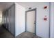 Hallway view of apartment unit number 302 with white door and blue trim at 13095 W Cedar Dr # 302, Lakewood, CO 80228