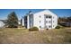 Well-maintained exterior view of the apartment complex at 13095 W Cedar Dr # 302, Lakewood, CO 80228