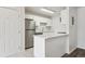 Modern kitchen featuring stainless steel appliances, white cabinets, and a breakfast bar at 13095 W Cedar Dr # 302, Lakewood, CO 80228