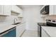 Well-appointed kitchen featuring white subway tile backsplash, and modern appliances at 13095 W Cedar Dr # 302, Lakewood, CO 80228