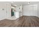 Open concept living room and kitchen with hardwood floors and fireplace at 13095 W Cedar Dr # 302, Lakewood, CO 80228