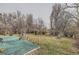 Expansive backyard with mature trees and landscaping offering serene privacy at 2108 S Idalia S St, Aurora, CO 80013