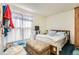 Serene bedroom featuring soft, natural light, a comfortable bed, and ample space for relaxation and personal touches at 2108 S Idalia S St, Aurora, CO 80013
