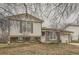 Charming home with a brick facade and green trim, showcasing its inviting curb appeal and well-maintained exterior at 2108 S Idalia S St, Aurora, CO 80013