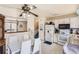 Charming kitchen with a ceiling fan and adjacent dining area, offering a cozy space for cooking and gathering at 2108 S Idalia S St, Aurora, CO 80013