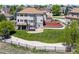 Aerial view of the large backyard, tiered landscaping, hot tub, deck and well-maintained lawn at 7226 Dove Ct, Parker, CO 80134