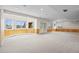 Finished basement with natural light, wet bar, and paneled accent walls at 7226 Dove Ct, Parker, CO 80134
