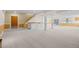 Expansive finished basement with wet bar, wood-paneled walls, and plenty of open space at 7226 Dove Ct, Parker, CO 80134