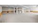 Large finished basement with columns, recessed lighting, and wet bar for entertaining at 7226 Dove Ct, Parker, CO 80134