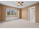 The bedroom has a large window with outdoor views and a built-in bench seat with storage at 7226 Dove Ct, Parker, CO 80134