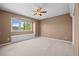 Cozy bedroom features a ceiling fan and a window seat with storage beneath at 7226 Dove Ct, Parker, CO 80134