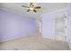 Airy bedroom with ceiling fan and an ensuite bathroom at 7226 Dove Ct, Parker, CO 80134