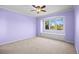 Bright bedroom features a large window with bench seating and a ceiling fan for added comfort at 7226 Dove Ct, Parker, CO 80134