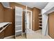 The walk-in closet has storage shelving with an open doorway and access to the bedroom at 7226 Dove Ct, Parker, CO 80134